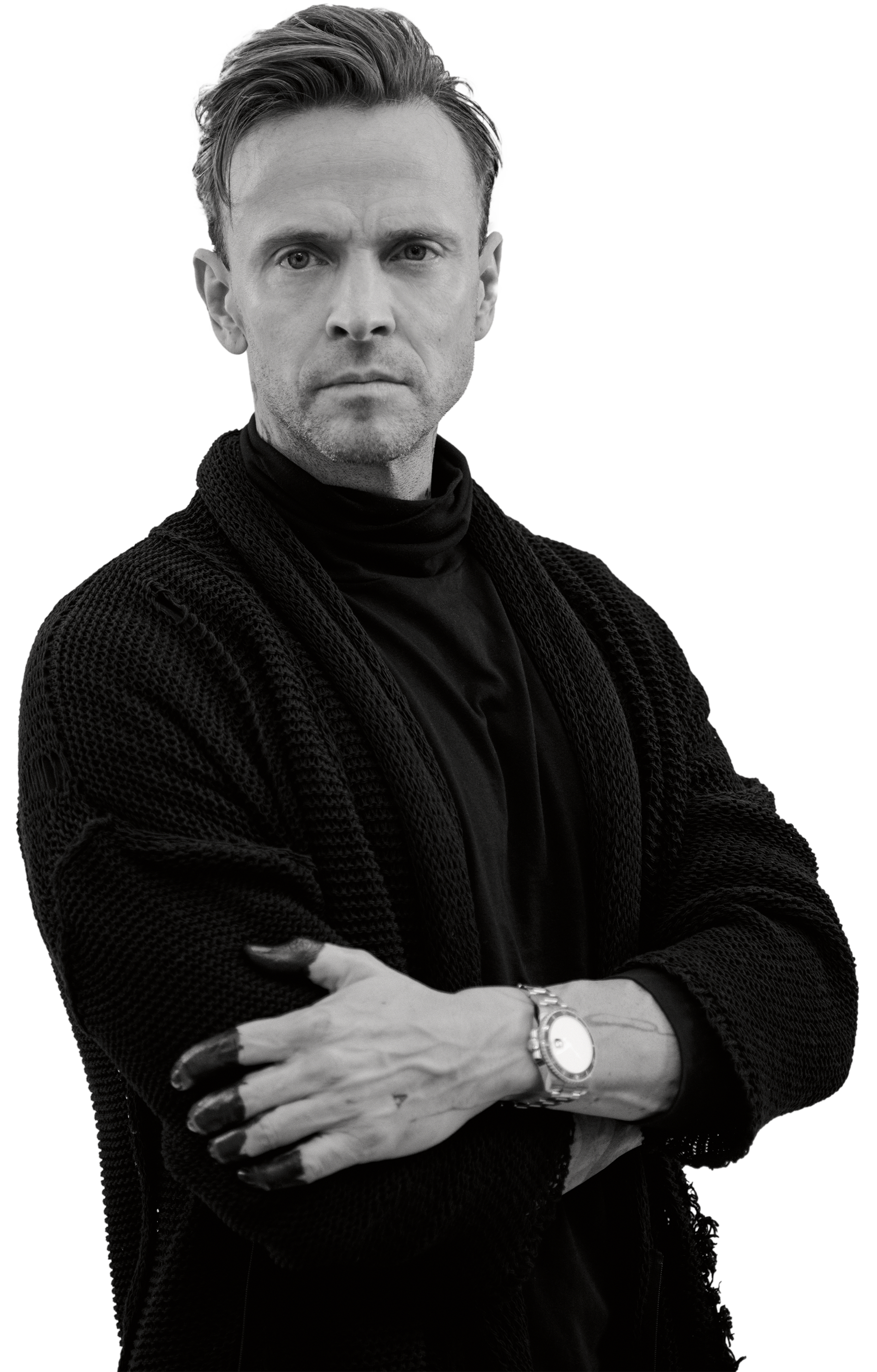 Black-and-white portrait of Maxim Havlíček with his arms folded